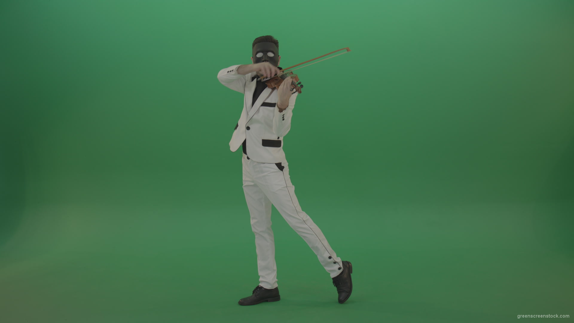 Violinist-in-a-white-jacket-and-in-a-black-mask-with-white-eyes-plays-melodically-on-the-violin_005 Green Screen Stock