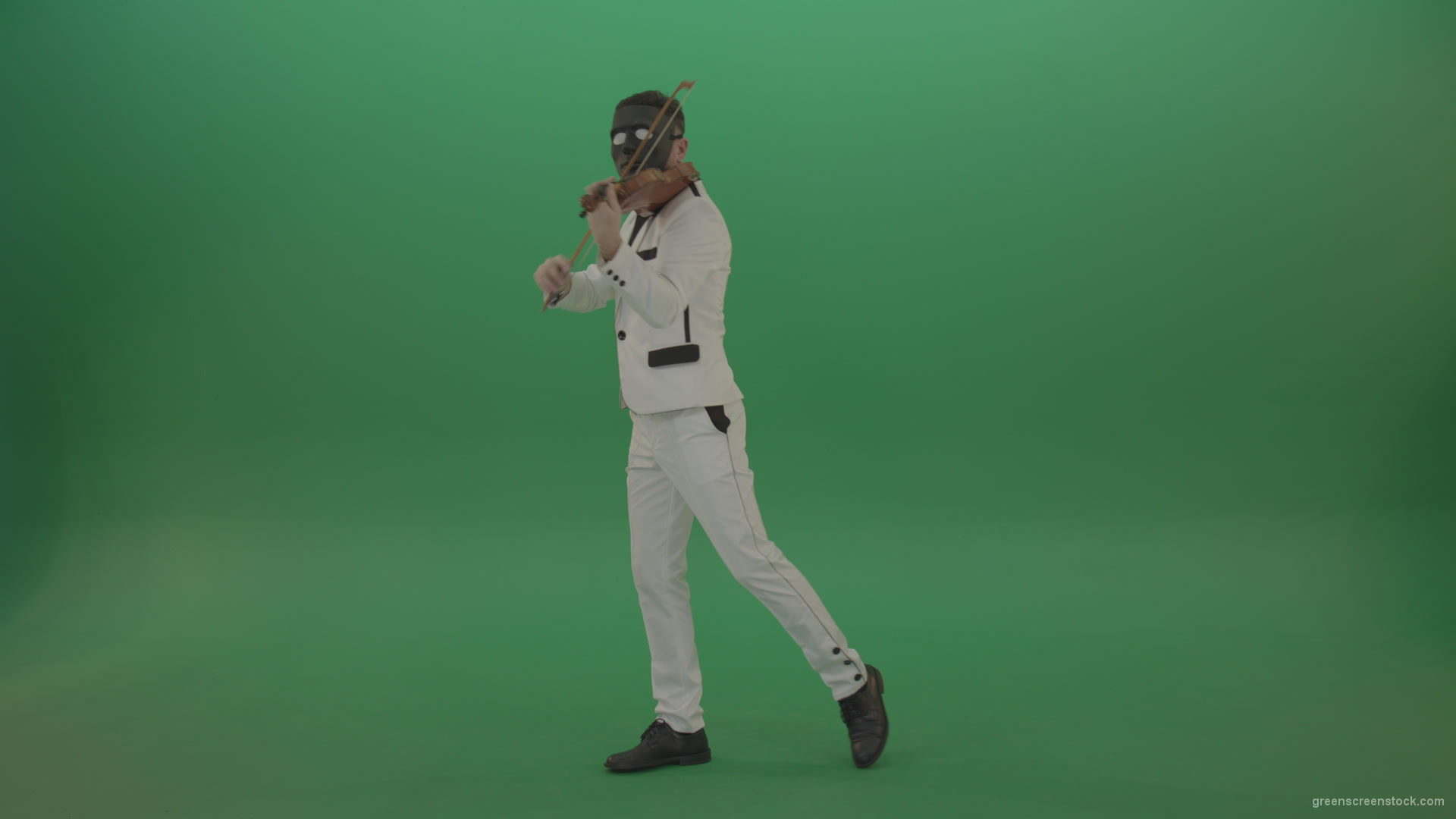 Violinist-in-a-white-jacket-and-in-a-black-mask-with-white-eyes-plays-melodically-on-the-violin_007 Green Screen Stock