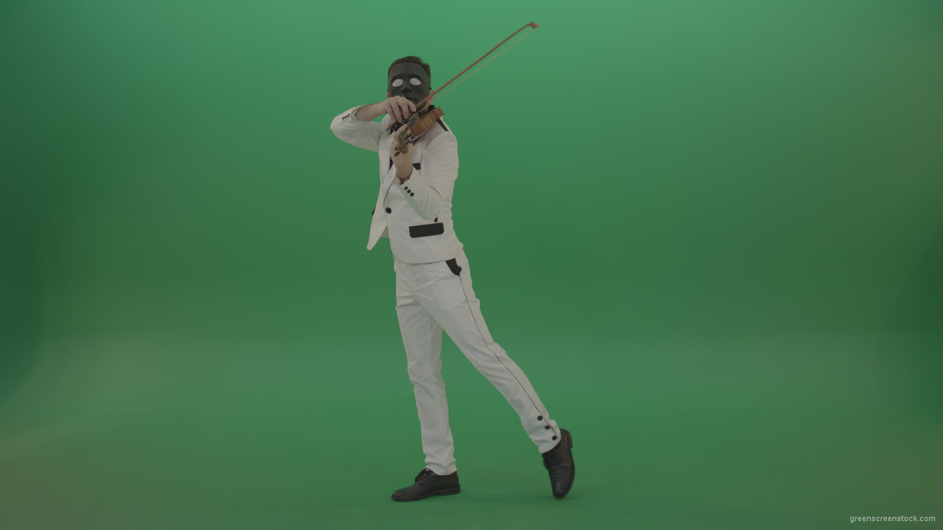 Violinist-in-a-white-jacket-and-in-a-black-mask-with-white-eyes-plays-melodically-on-the-violin_008 Green Screen Stock