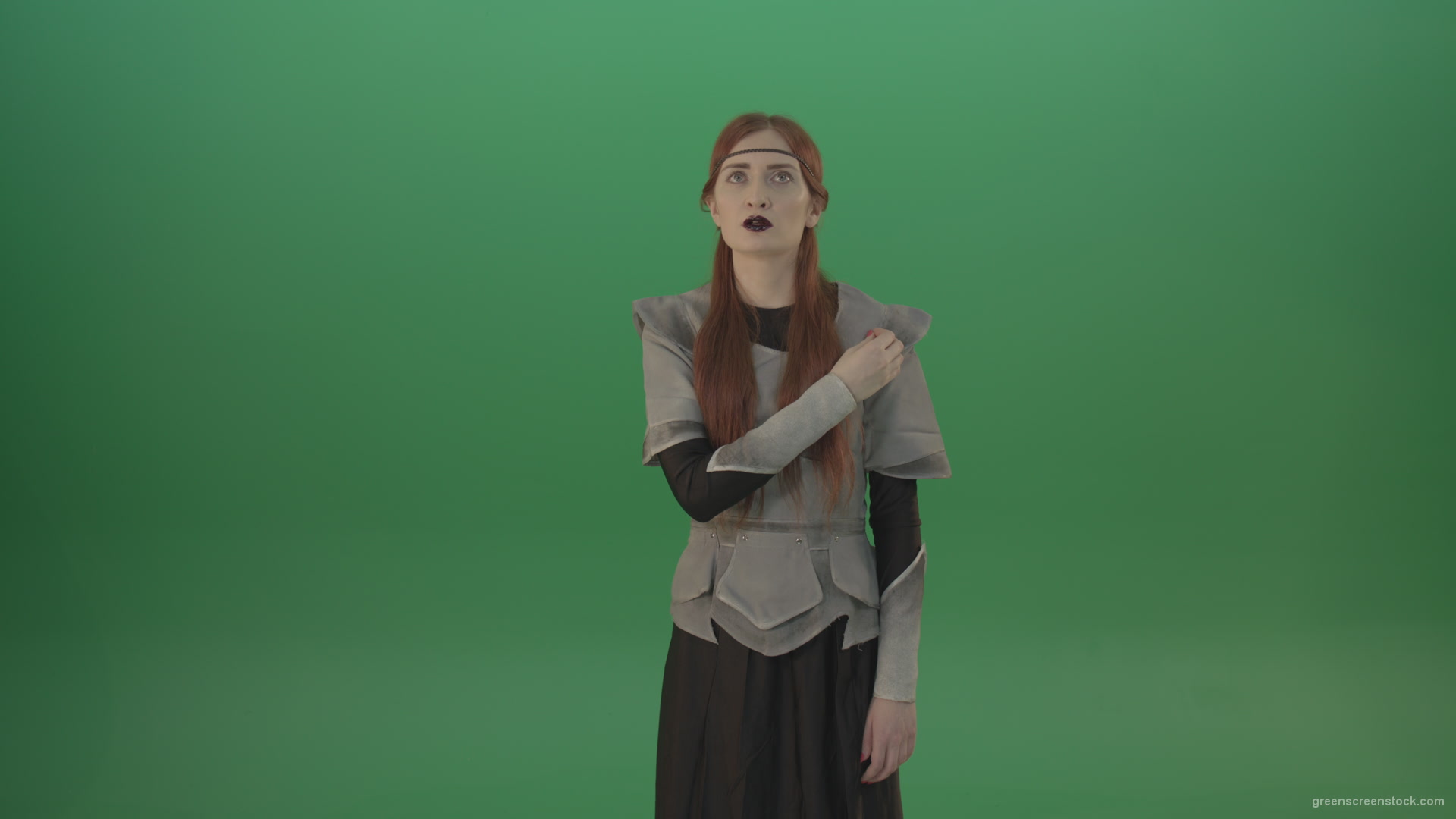 Actress-red-hair-girl-in-a-medieval-war-dress-crosses-praying-to-God-on-green-screen_006 Green Screen Stock