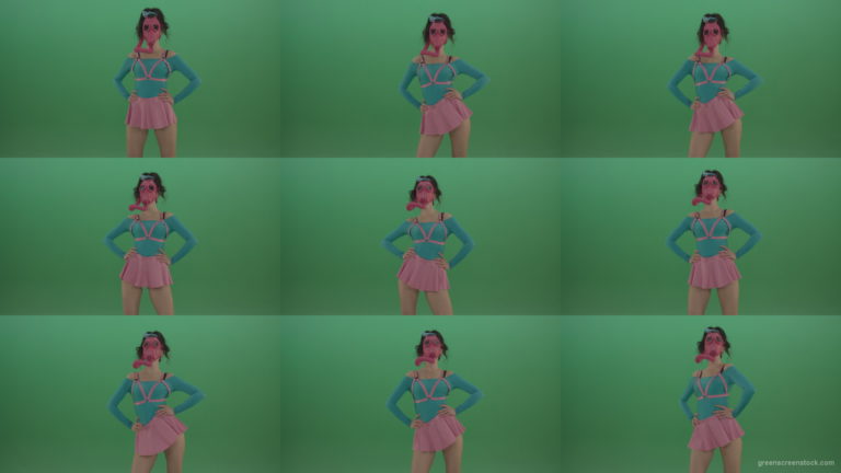 Beautiful-erotic-dance-from-a-woman-in-a-mask-in-a-pink-suit-on-green-background Green Screen Stock