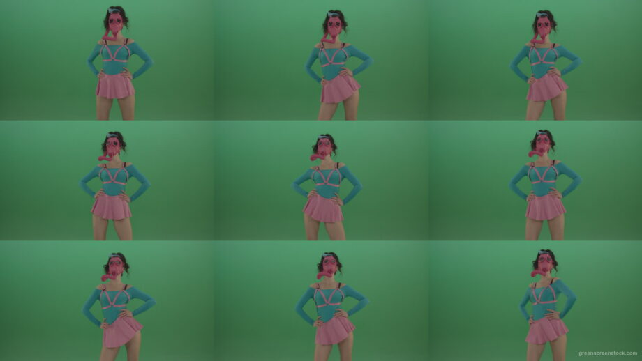 Beautiful-erotic-dance-from-a-woman-in-a-mask-in-a-pink-suit-on-green-background Green Screen Stock