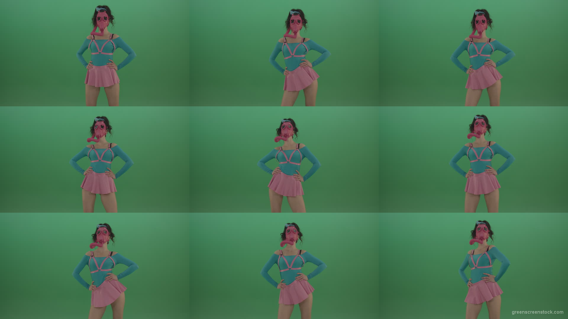 Beautiful-erotic-dance-from-a-woman-in-a-mask-in-a-pink-suit-on-green-background Green Screen Stock