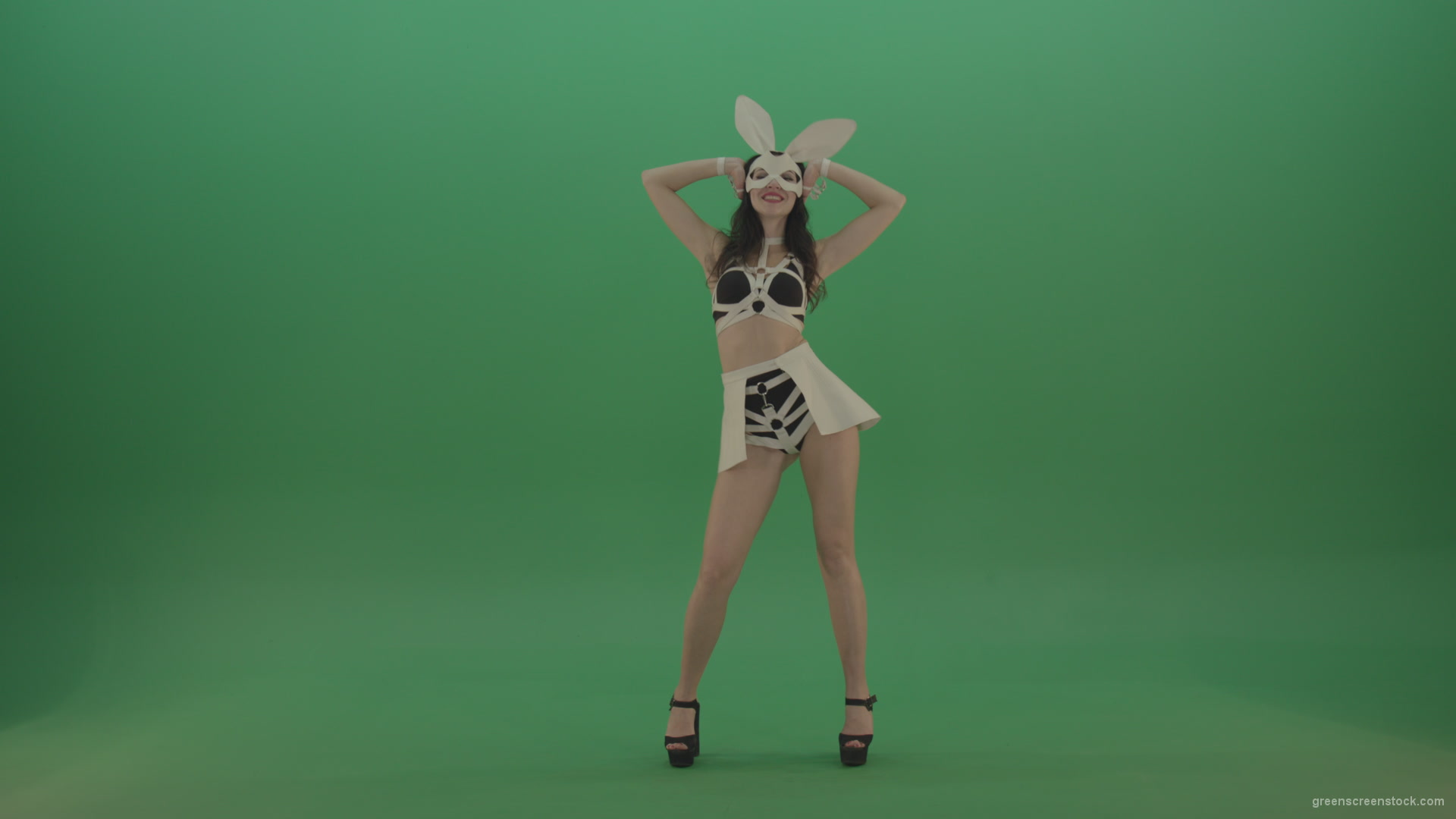 Black-white-sexy-costume-the-girl-moves-the-basin-in-different-directions-on-chromakey-background_008 Green Screen Stock
