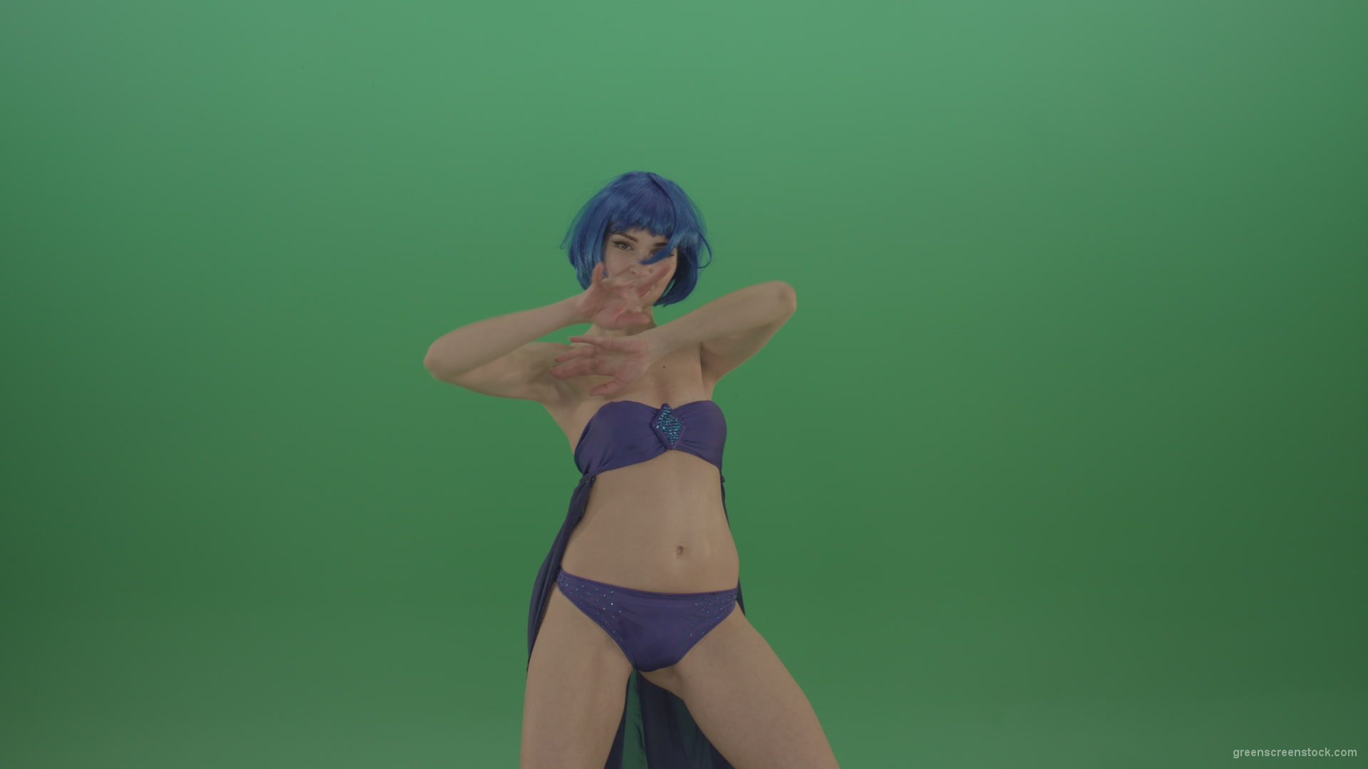  Blue  hair girl dancing  sexy strip isolated on green 