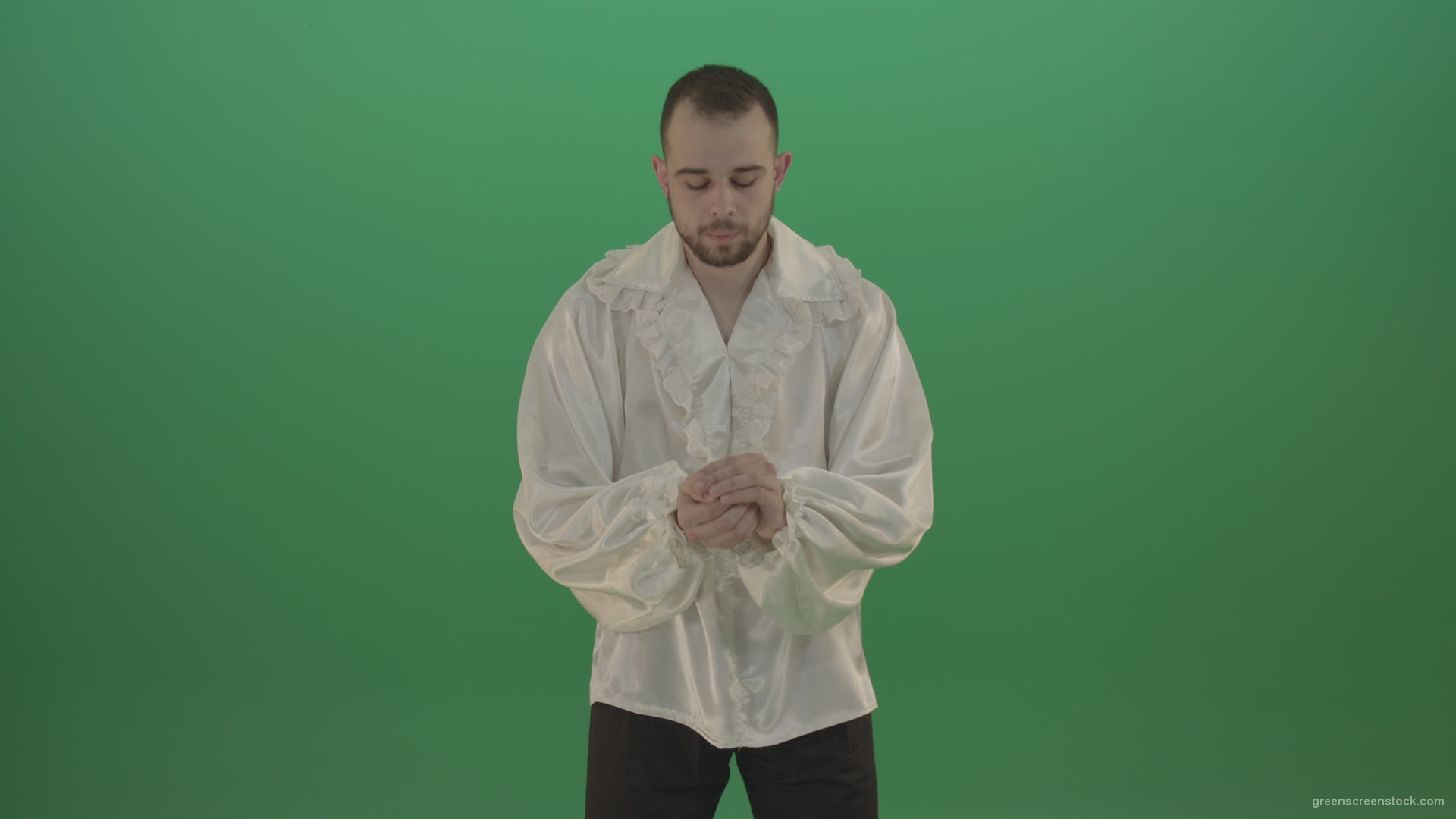 Boy-gives-flower-squeezing-in-the-sleeves-elegantly-in-hand-isolated-on-green-screen_002 Green Screen Stock