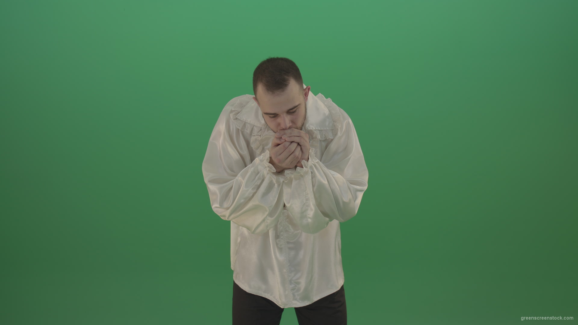 Boy-gives-flower-squeezing-in-the-sleeves-elegantly-in-hand-isolated-on-green-screen_004 Green Screen Stock