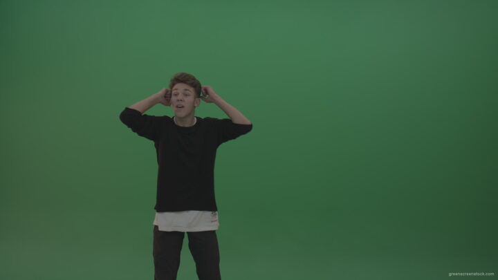 vj video background Boy-in-black-wear-displays-expression-as-he-whistles-over-chromakey-background_003