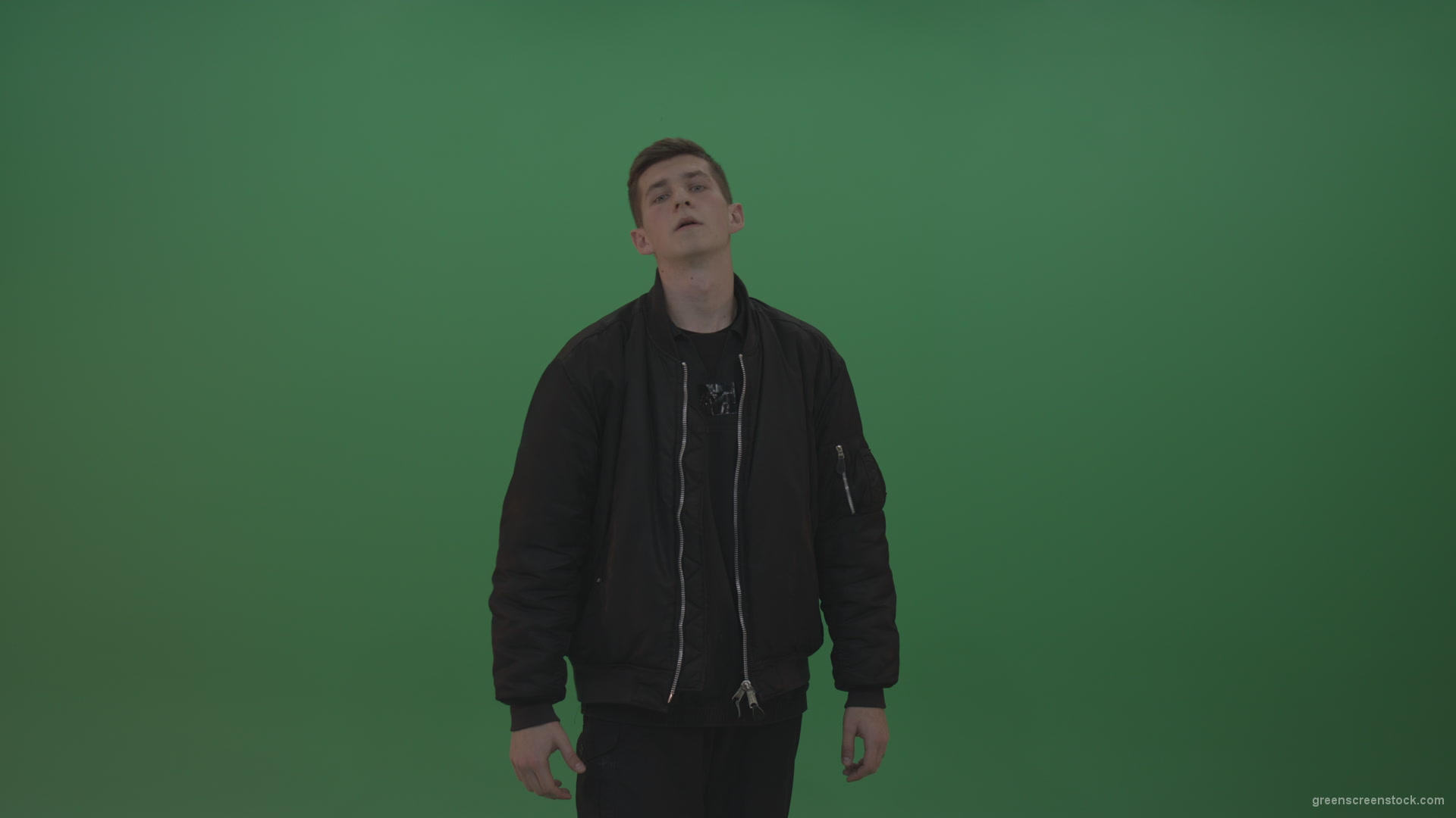 Boy-in-black-wear-displays-the-kill-sign-and-two-middle-fingers-in-the-air-over-chromakey-background_001 Green Screen Stock