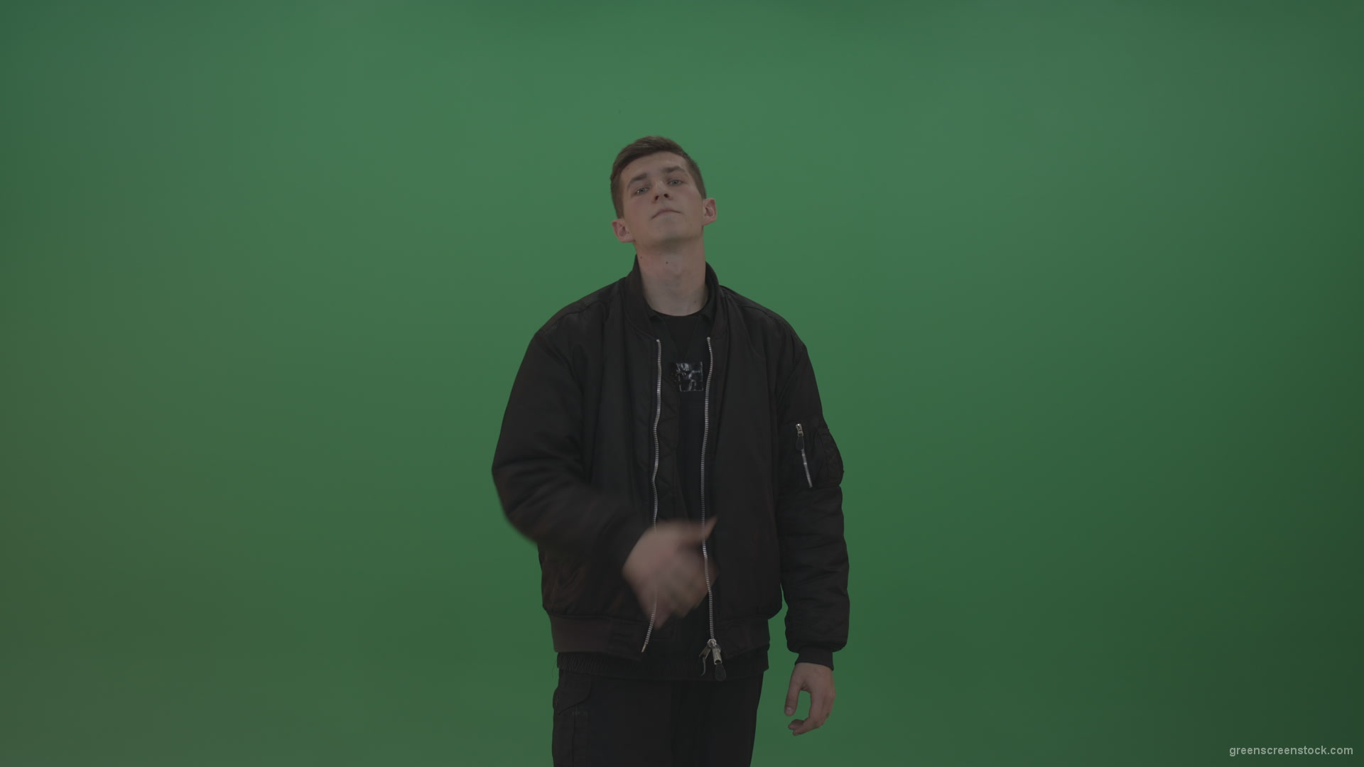 Boy-in-black-wear-displays-the-kill-sign-and-two-middle-fingers-in-the-air-over-chromakey-background_002 Green Screen Stock