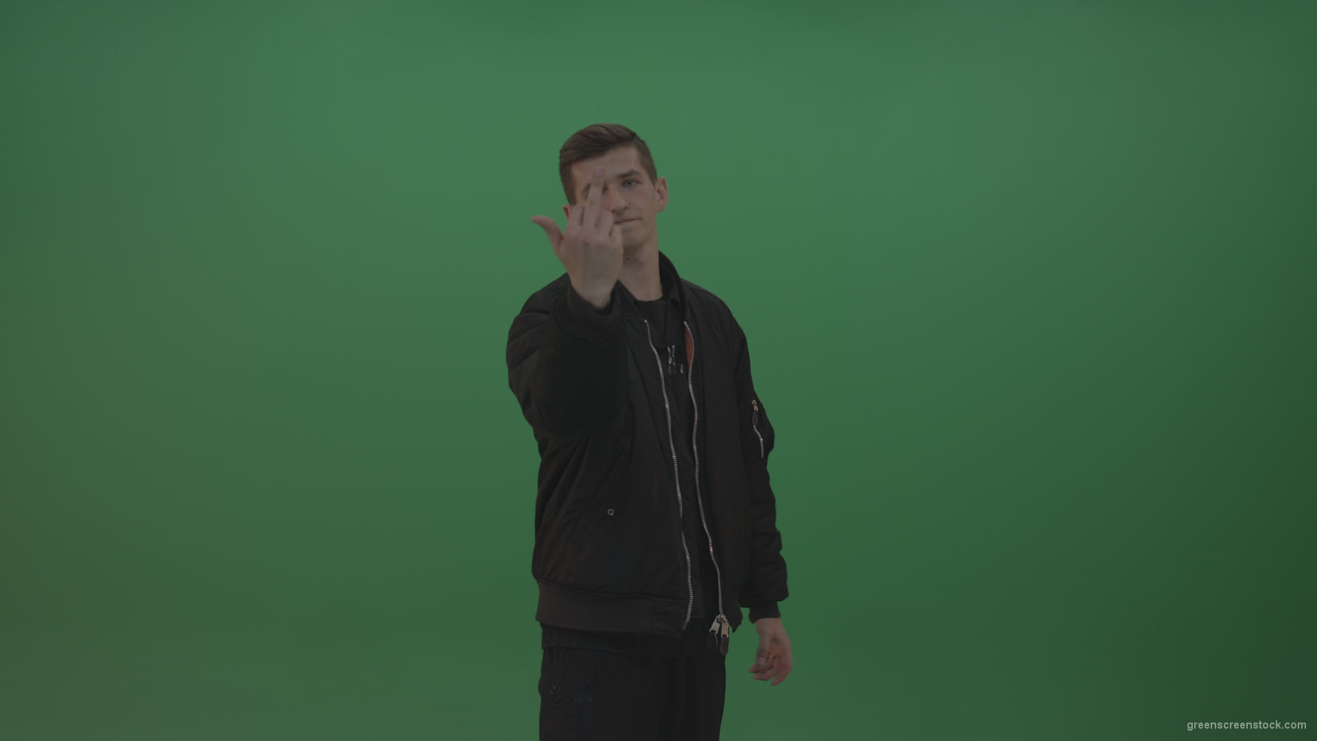 Boy-in-black-wear-displays-the-kill-sign-and-two-middle-fingers-in-the-air-over-chromakey-background_004 Green Screen Stock