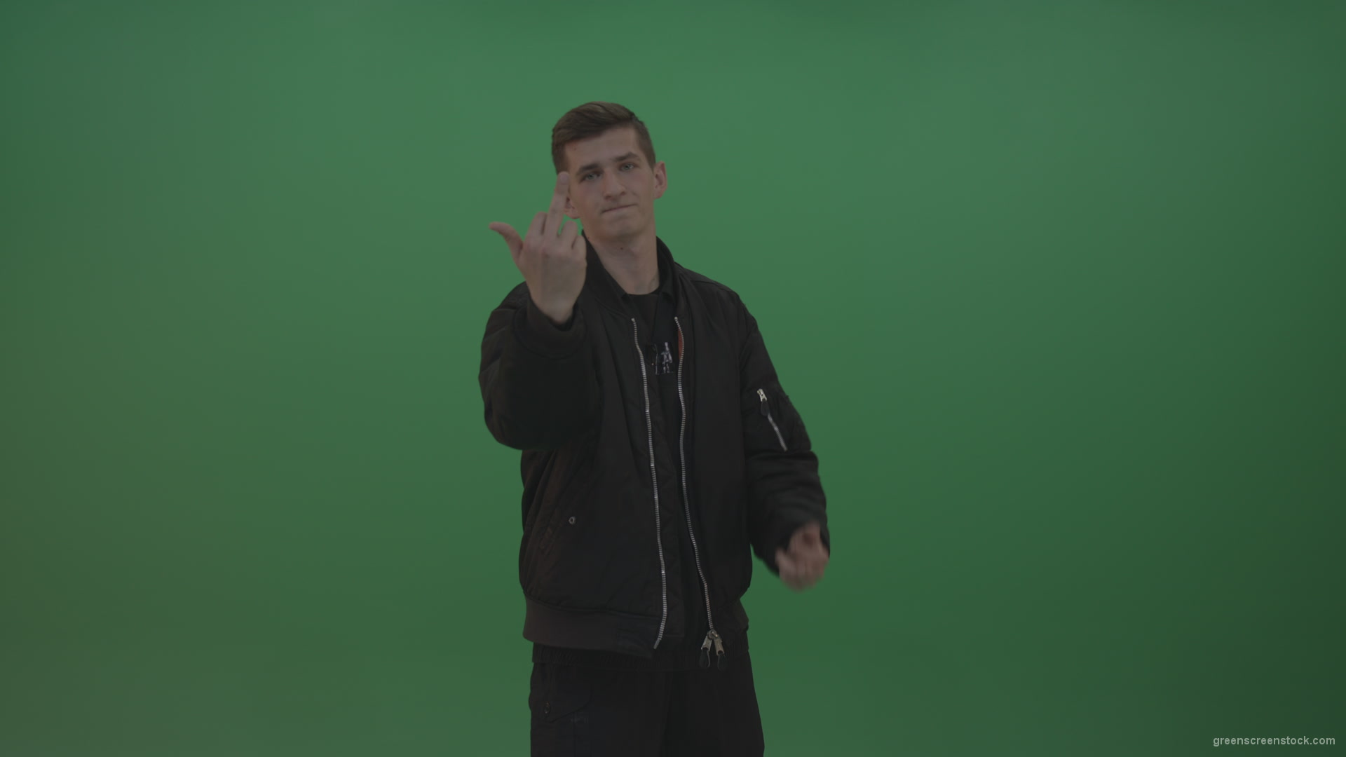 Boy-in-black-wear-displays-the-kill-sign-and-two-middle-fingers-in-the-air-over-chromakey-background_005 Green Screen Stock
