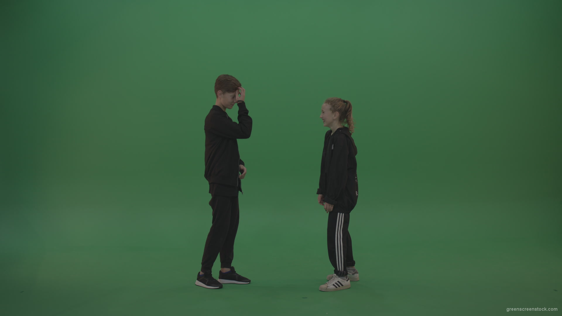 Boy-in-black-wear-talks-to-girl-over-chromakey-background_001 Green Screen Stock