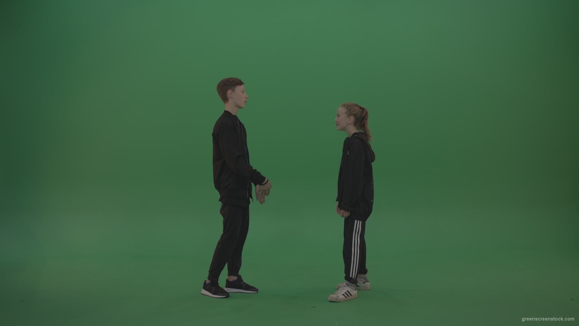 Boy-in-black-wear-talks-to-girl-over-chromakey-background_004 Green Screen Stock