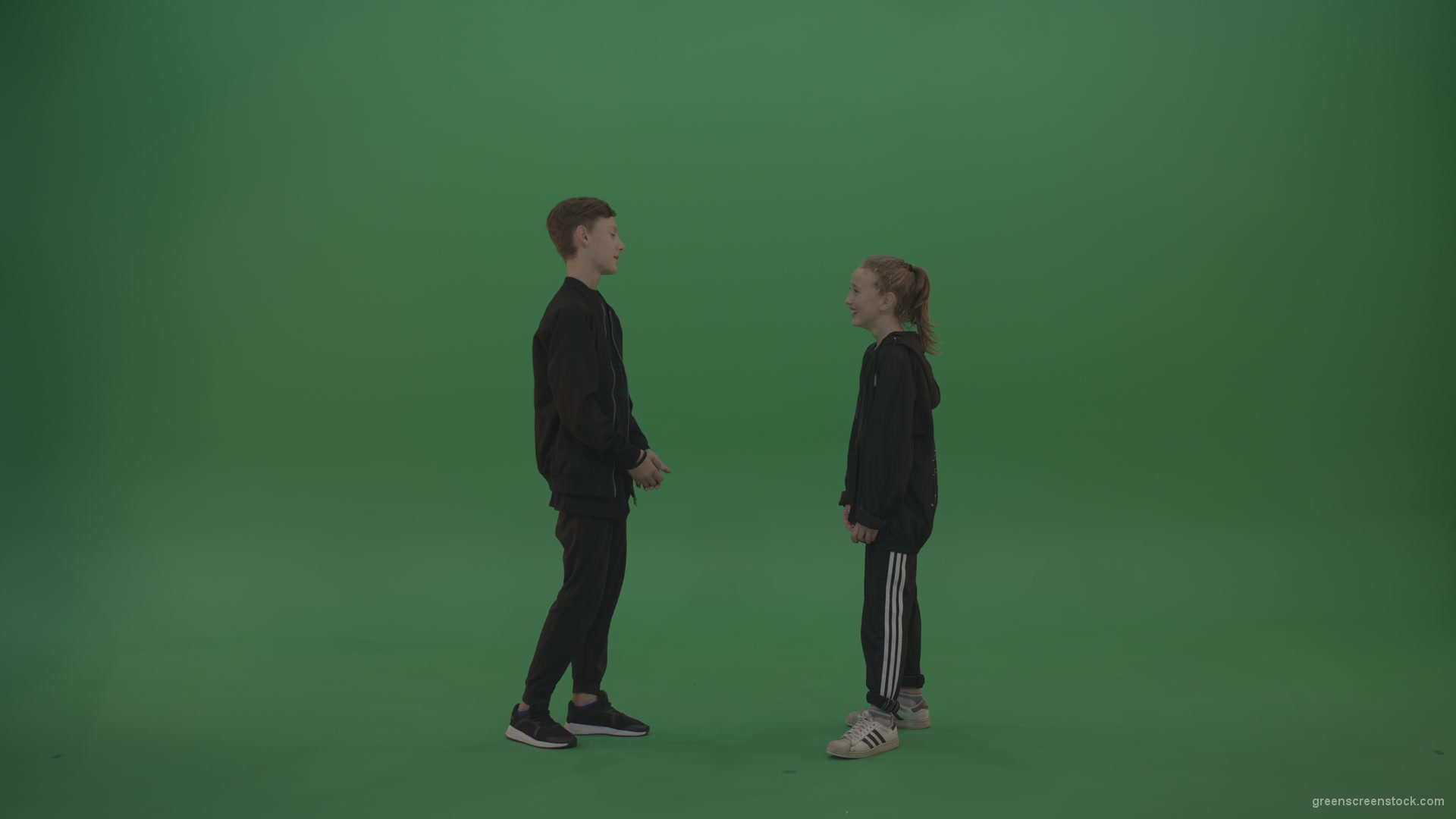 Boy-in-black-wear-talks-to-girl-over-chromakey-background_005 Green Screen Stock