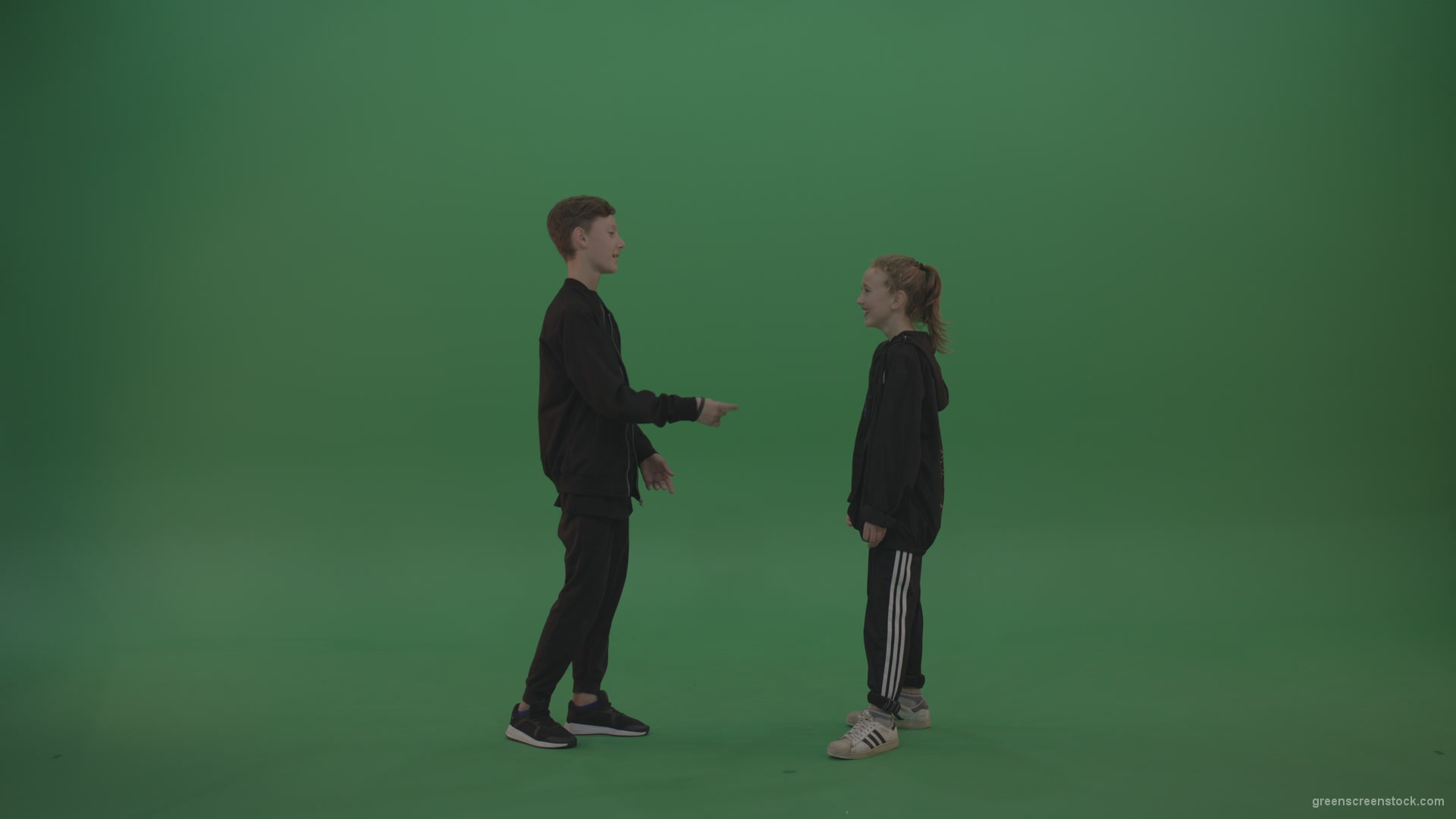 Boy-in-black-wear-talks-to-girl-over-chromakey-background_006 Green Screen Stock