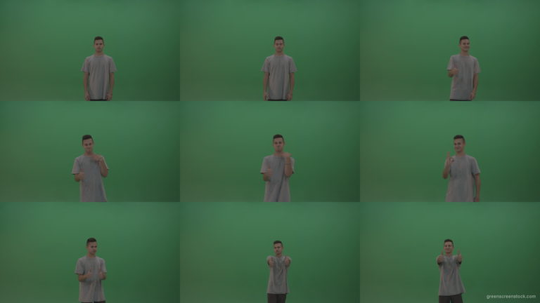 Boy-in-grey-wear-expresses-approval-by-giving-thumbs-up-over-green-screen-background Green Screen Stock