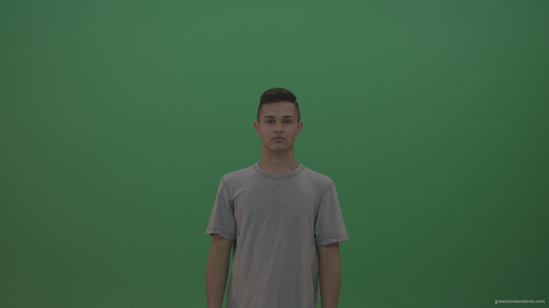 Boy-in-grey-wear-expresses-disappointment-over-green-screen-background_002 Green Screen Stock