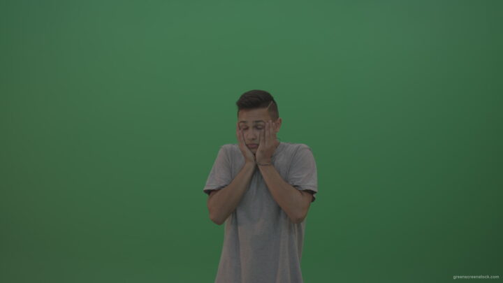 vj video background Boy-in-grey-wear-expresses-disappointment-over-green-screen-background_003