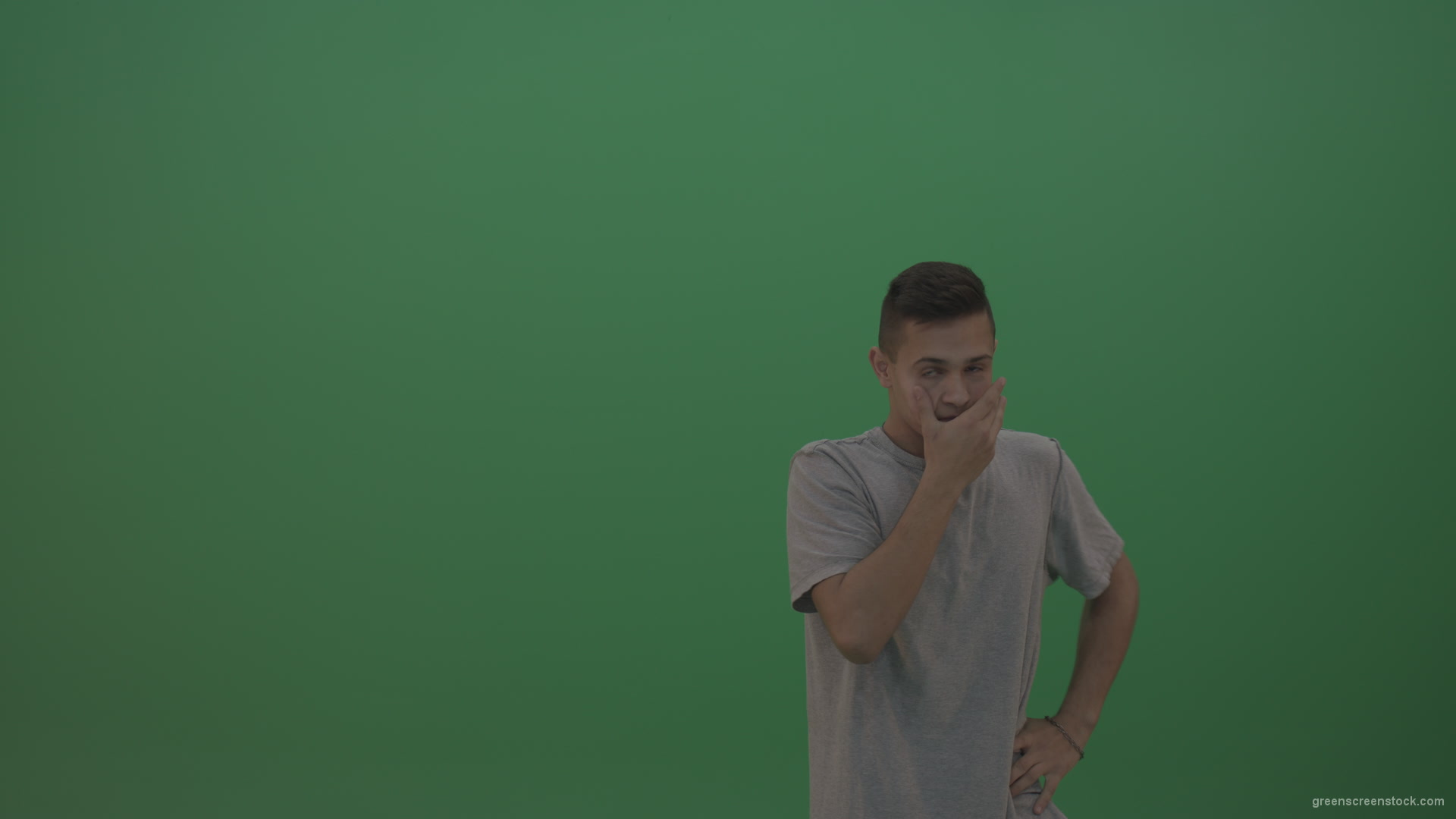 Boy-in-grey-wear-expresses-disappointment-over-green-screen-background_007 Green Screen Stock