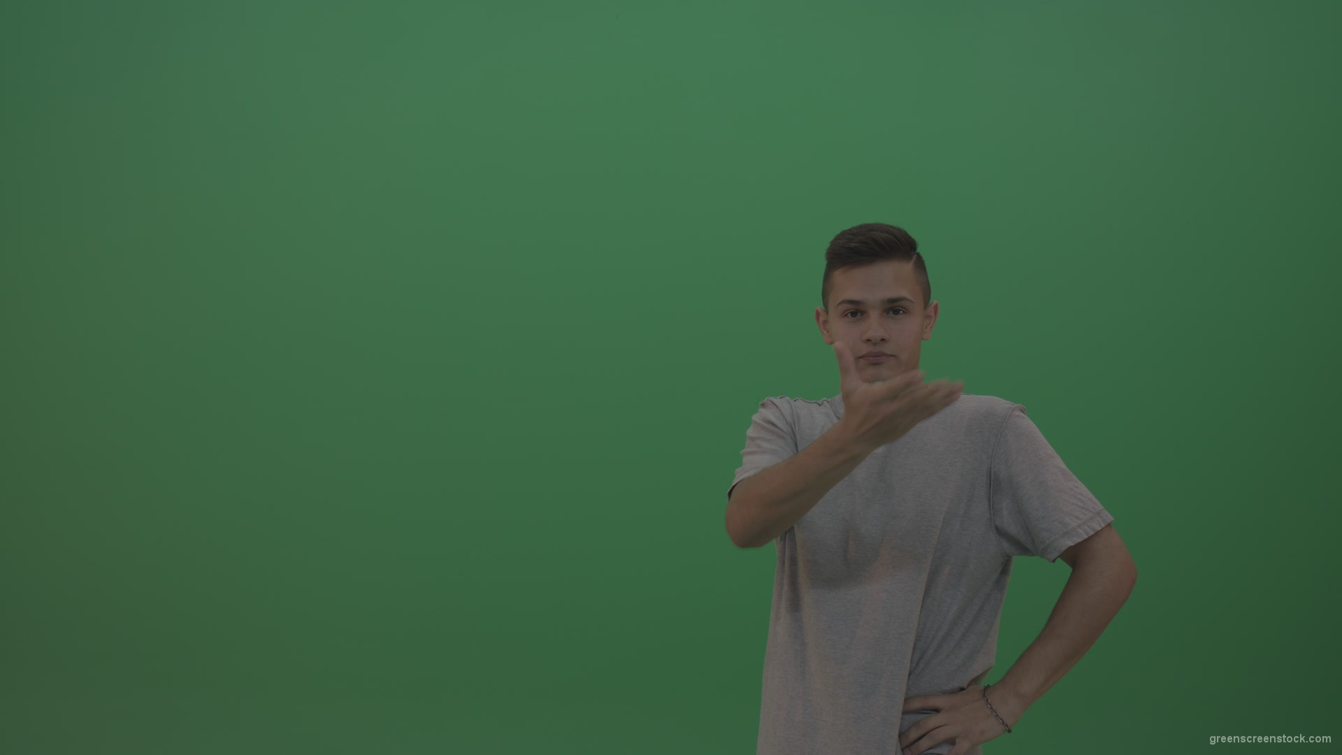 Boy-in-grey-wear-expresses-disappointment-over-green-screen-background_008 Green Screen Stock