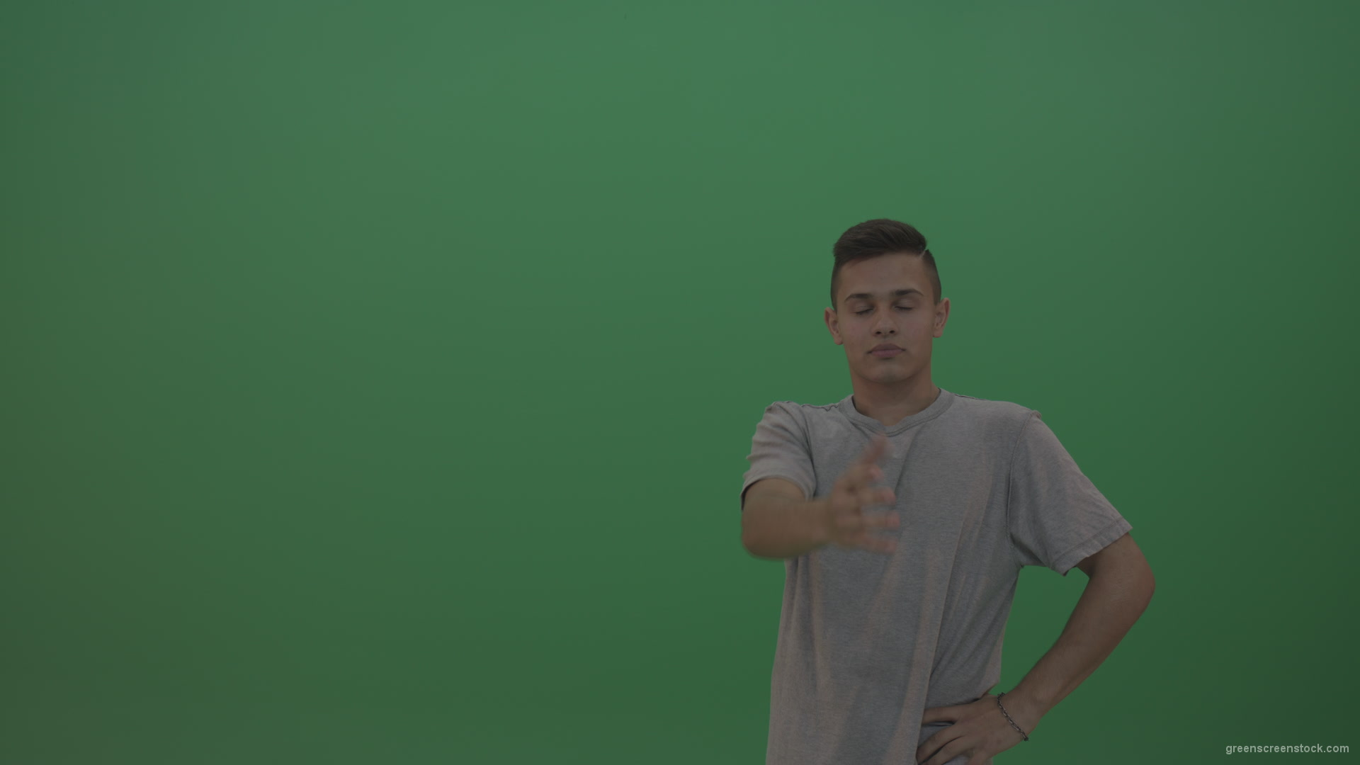 Boy-in-grey-wear-expresses-disappointment-over-green-screen-background_009 Green Screen Stock