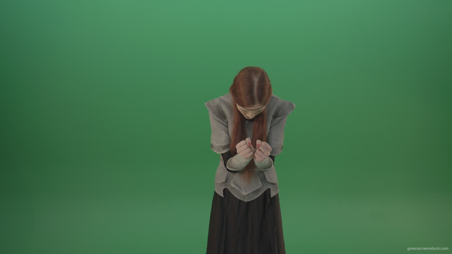 Cried-warrior-girl-releases-all-her-energy-cosplay-on-a-green-background_004 Green Screen Stock