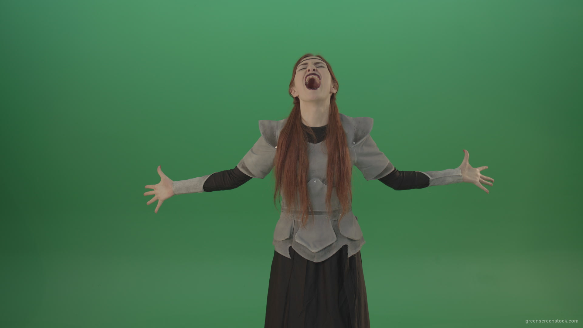 Cried-warrior-girl-releases-all-her-energy-cosplay-on-a-green-background_008 Green Screen Stock