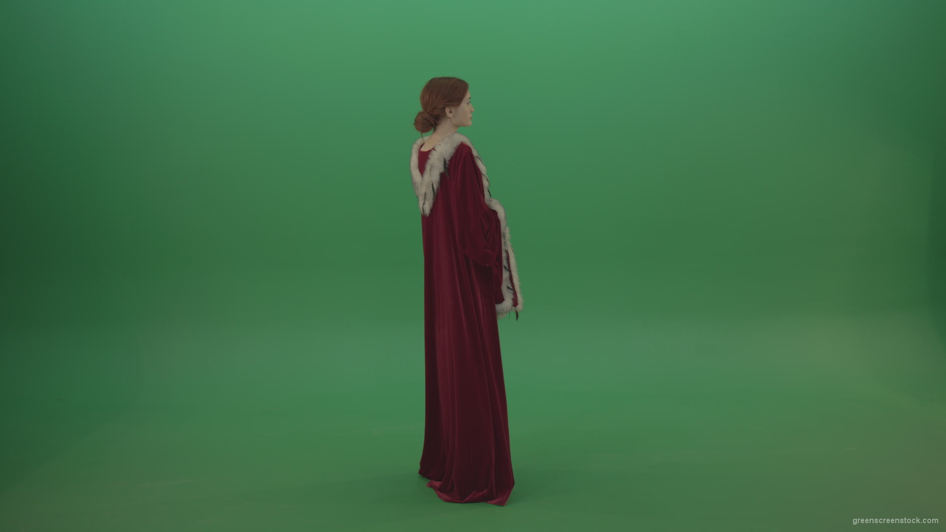 Elegant-woman-princess-with-light-movements-shows-her-beauty-dressed-in-red-cloak-on-a-green-background_004 Green Screen Stock
