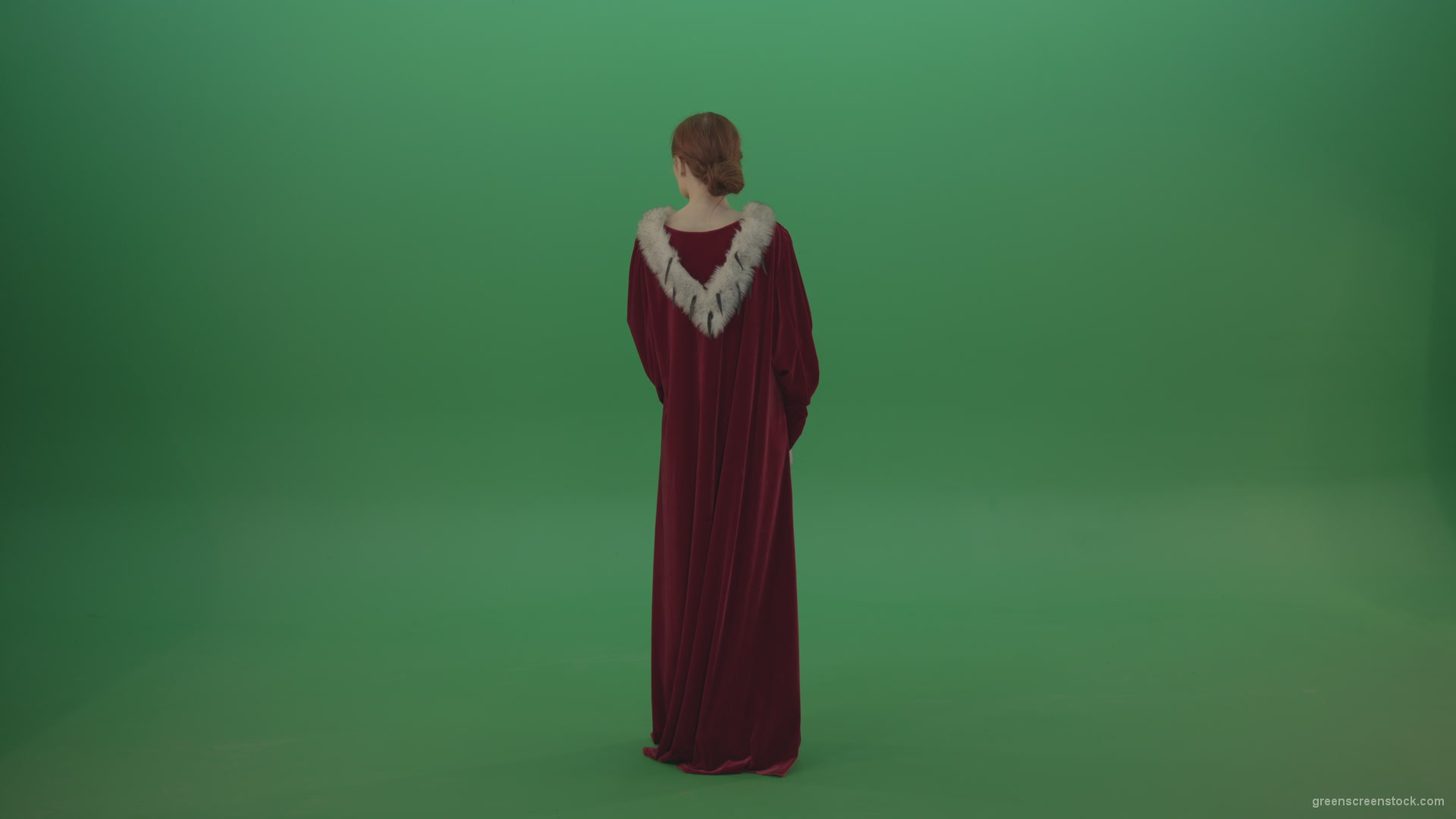 Elegant-woman-princess-with-light-movements-shows-her-beauty-dressed-in-red-cloak-on-a-green-background_005 Green Screen Stock