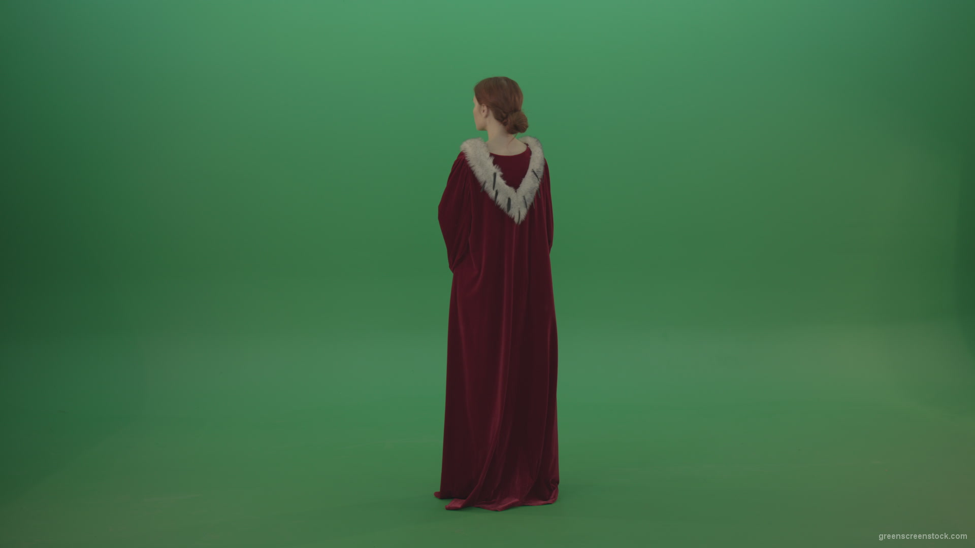 Elegant-woman-princess-with-light-movements-shows-her-beauty-dressed-in-red-cloak-on-a-green-background_006 Green Screen Stock