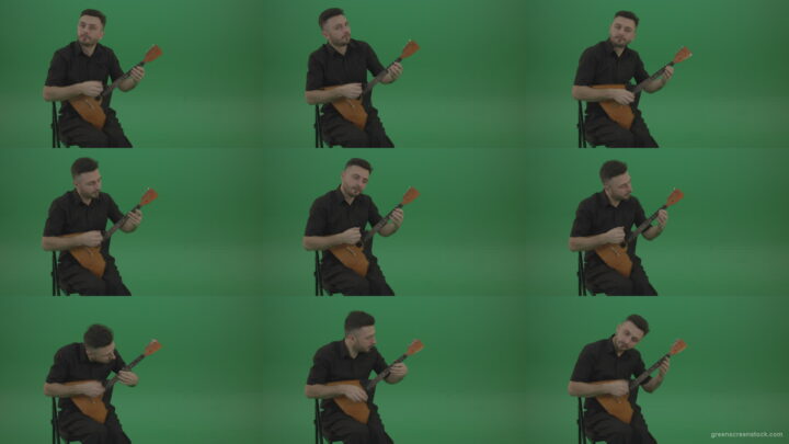 Funny-Balalaika-music-player-in-black-wear-playing-in-wedding-isolated-on-green-screen-background Green Screen Stock