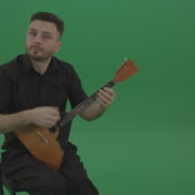 Funny-Balalaika-music-player-in-black-wear-playing-in-wedding-isolated-on-green-screen-background_001 Green Screen Stock