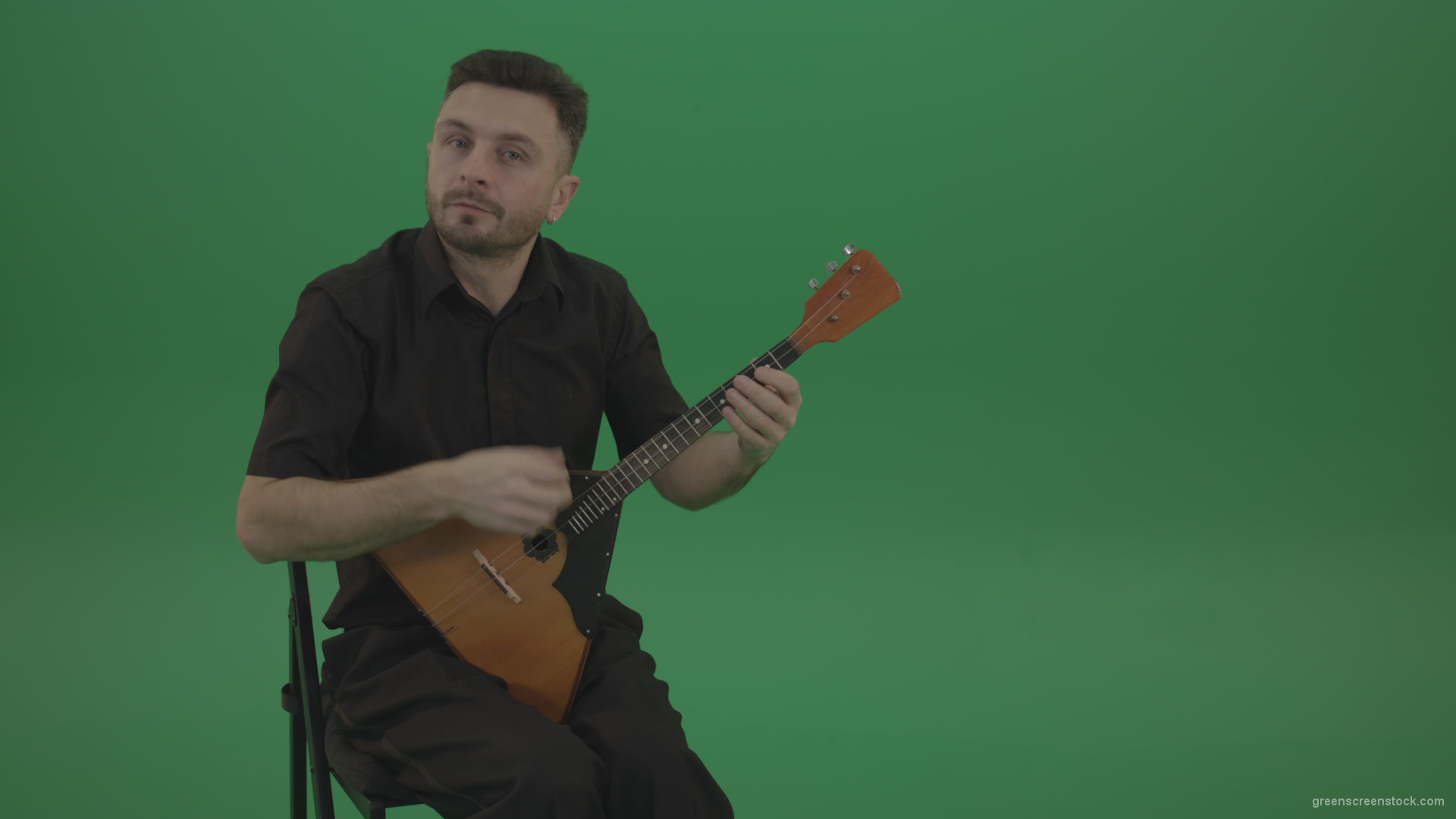Funny-Balalaika-music-player-in-black-wear-playing-in-wedding-isolated-on-green-screen-background_001 Green Screen Stock