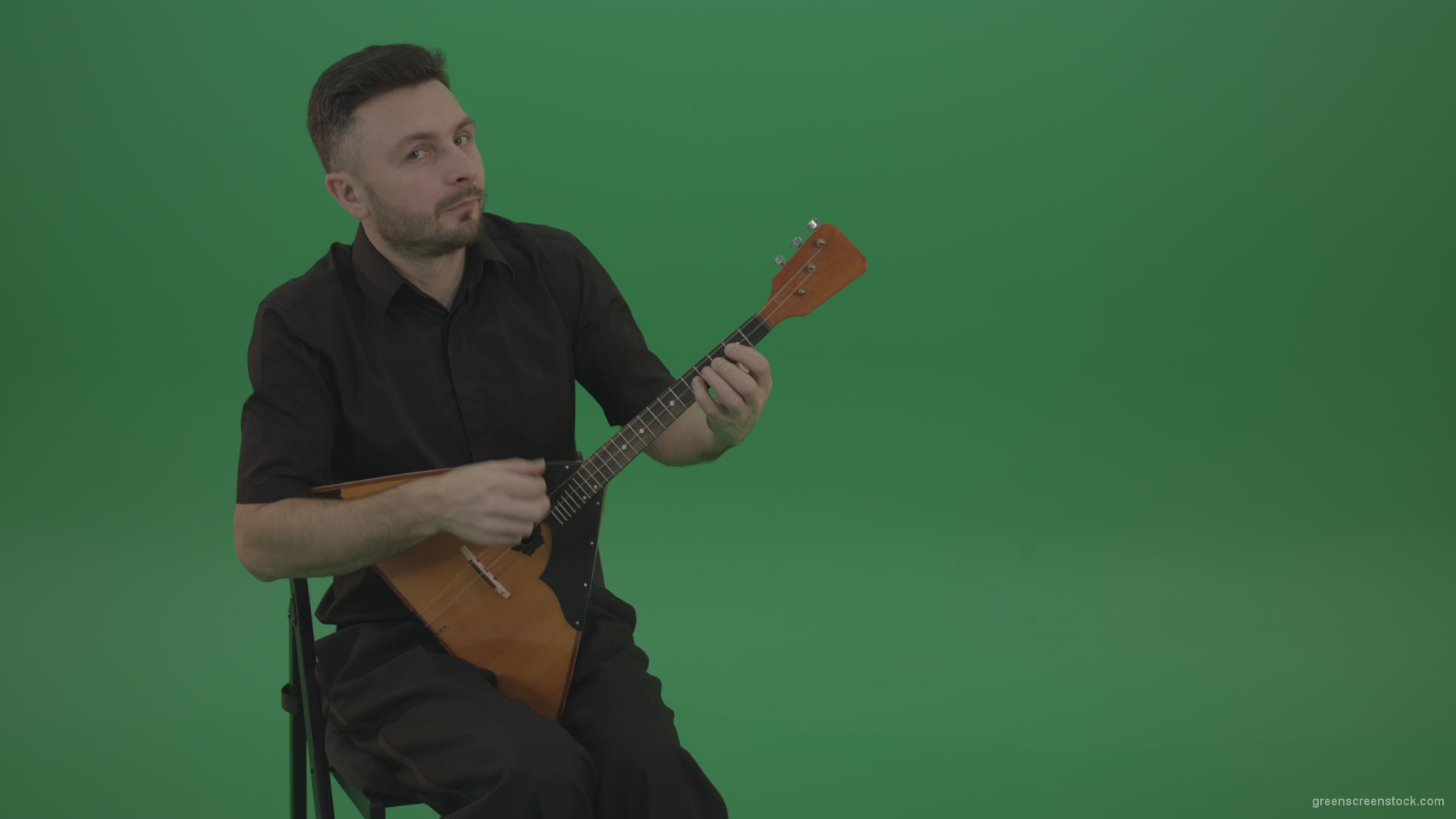 Funny-Balalaika-music-player-in-black-wear-playing-in-wedding-isolated-on-green-screen-background_002 Green Screen Stock