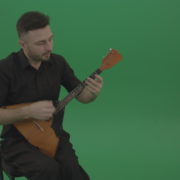 Funny-Balalaika-music-player-in-black-wear-playing-in-wedding-isolated-on-green-screen-background_004 Green Screen Stock