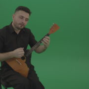 Funny-Balalaika-music-player-in-black-wear-playing-in-wedding-isolated-on-green-screen-background_005 Green Screen Stock