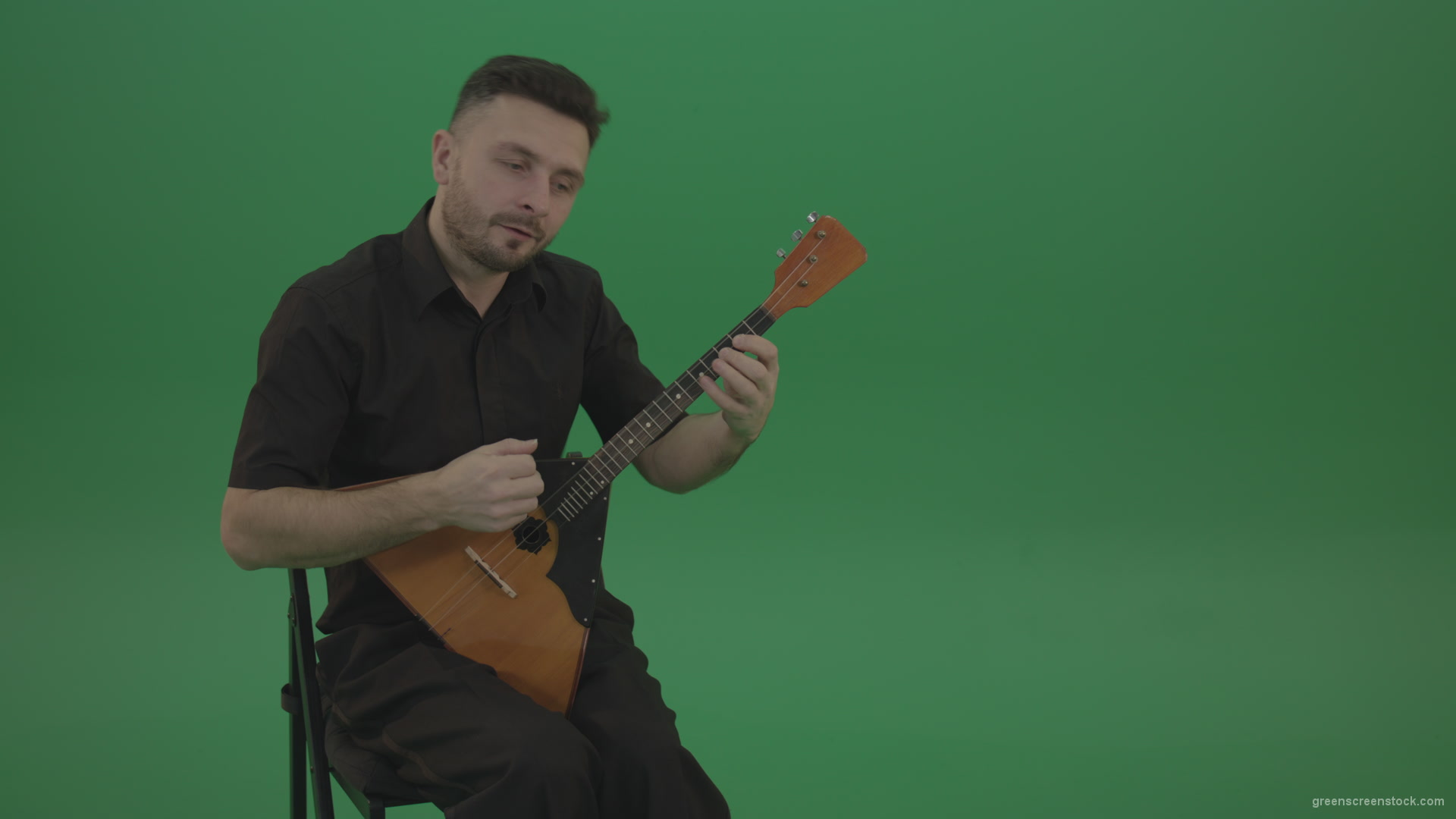 Funny-Balalaika-music-player-in-black-wear-playing-in-wedding-isolated-on-green-screen-background_005 Green Screen Stock