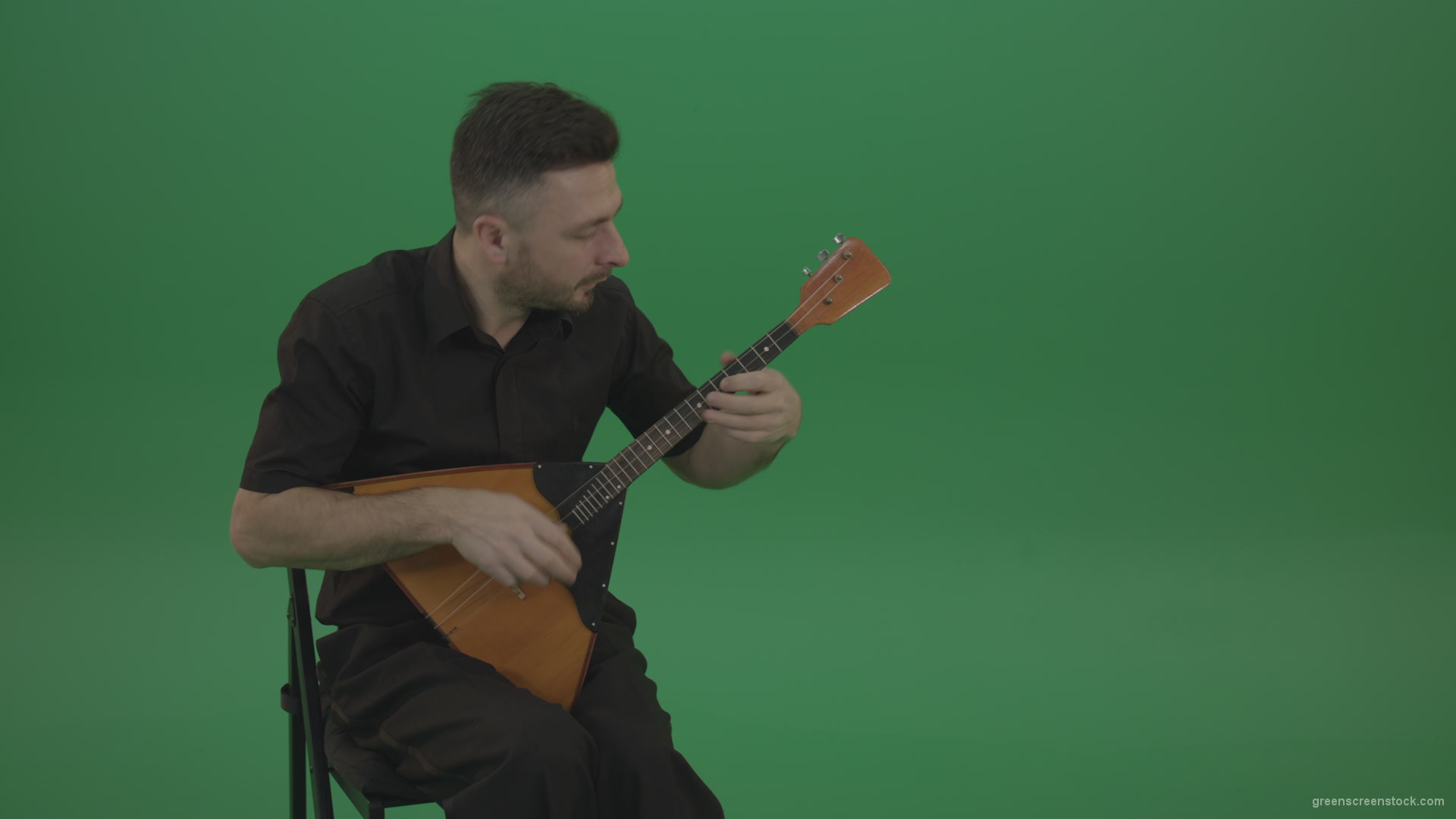 Funny-Balalaika-music-player-in-black-wear-playing-in-wedding-isolated-on-green-screen-background_008 Green Screen Stock