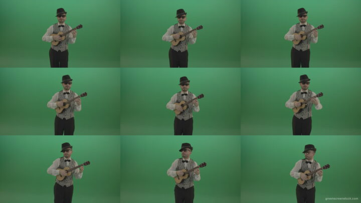 Funny-guitar-player-with-small-classic-guitar-on-chromakey-green-screen Green Screen Stock