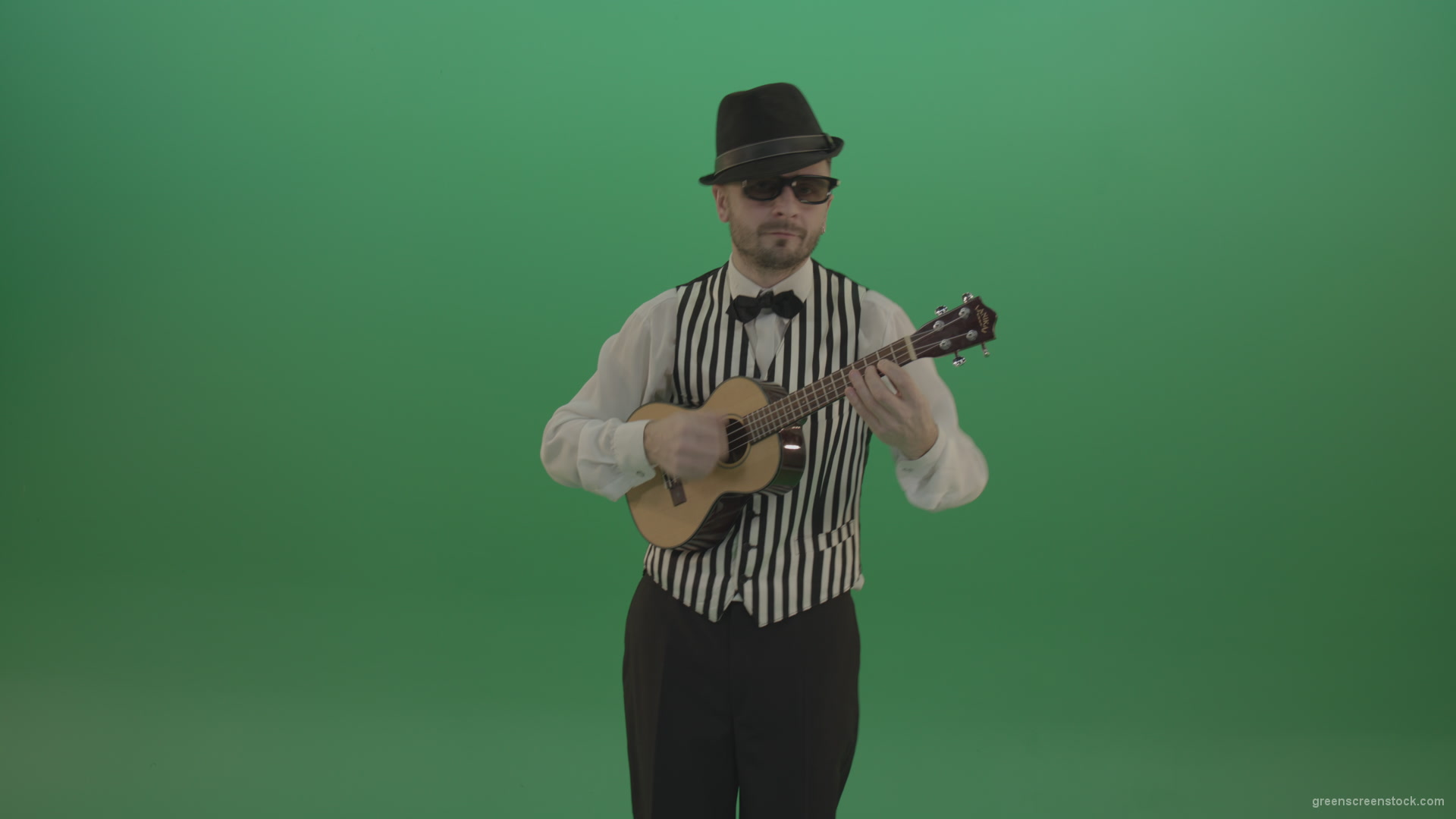 Funny-guitar-player-with-small-classic-guitar-on-chromakey-green-screen_006 Green Screen Stock