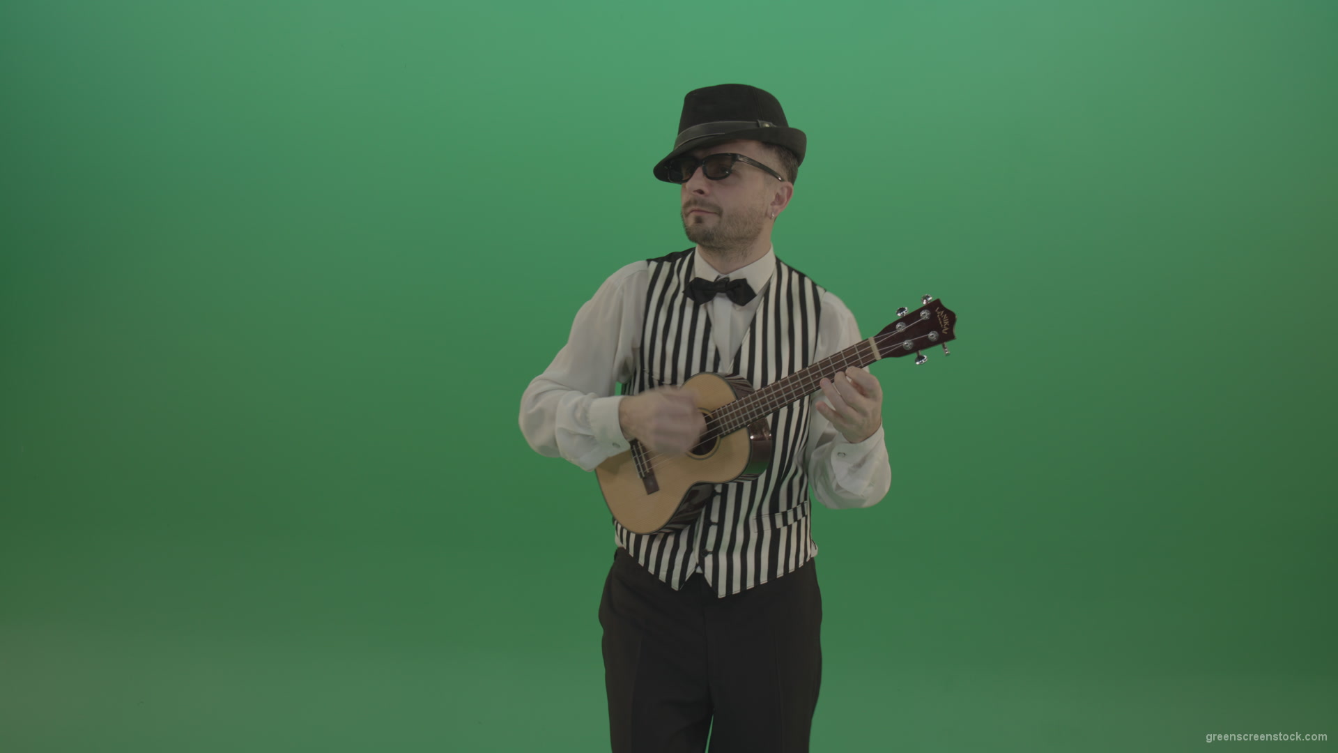 Funny-guitar-player-with-small-classic-guitar-on-chromakey-green-screen_008 Green Screen Stock