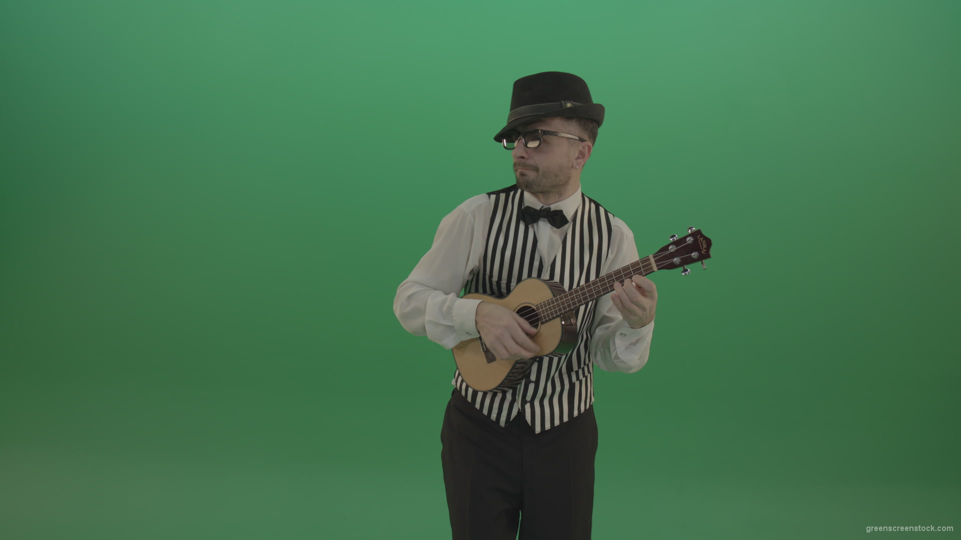 Funny-guitar-player-with-small-classic-guitar-on-chromakey-green-screen_009 Green Screen Stock