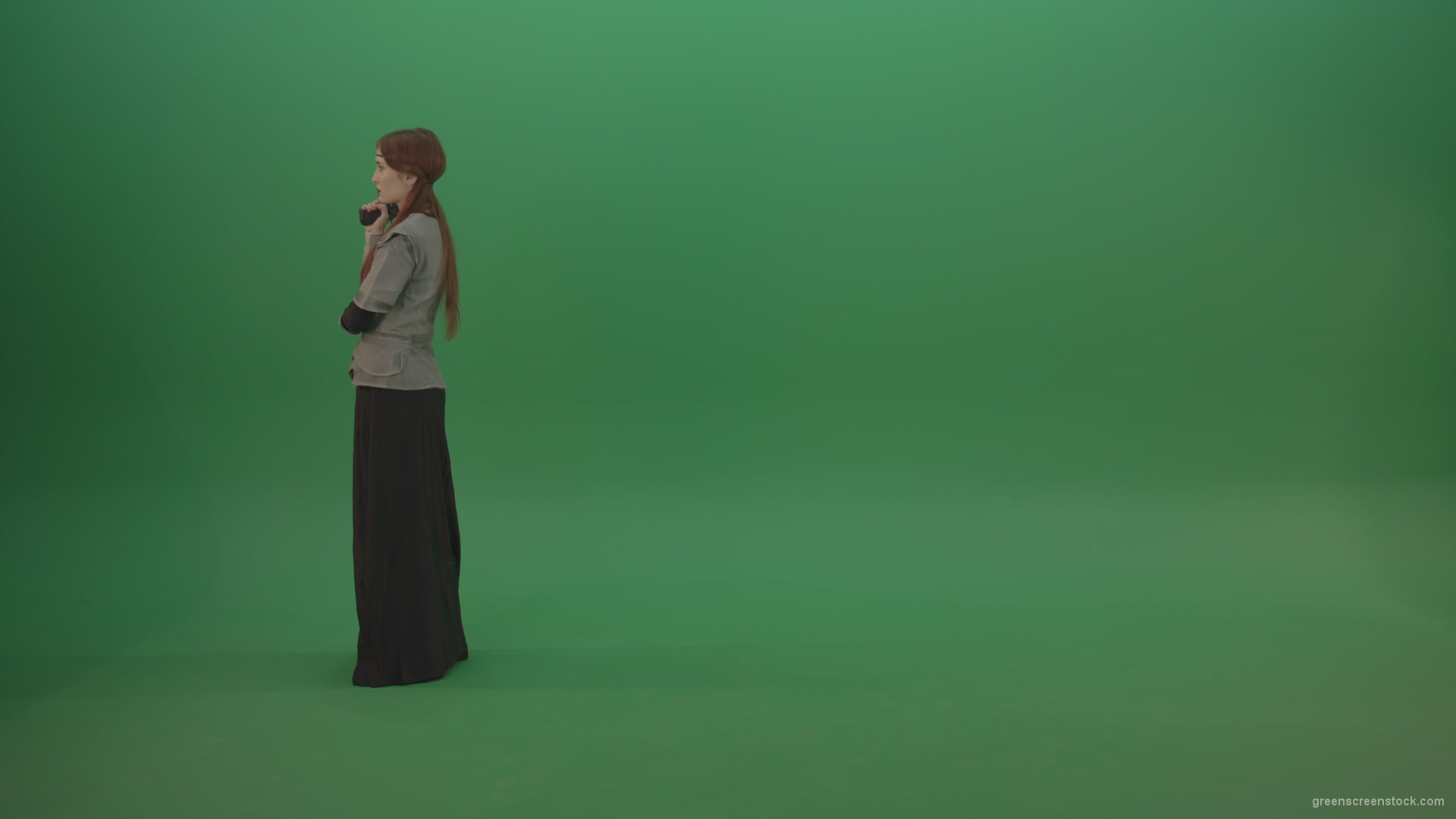 Girl-dressed-in-an-ancient-costume-holds-a-gun-in-her-hands-walks-and-shoots_001 Green Screen Stock