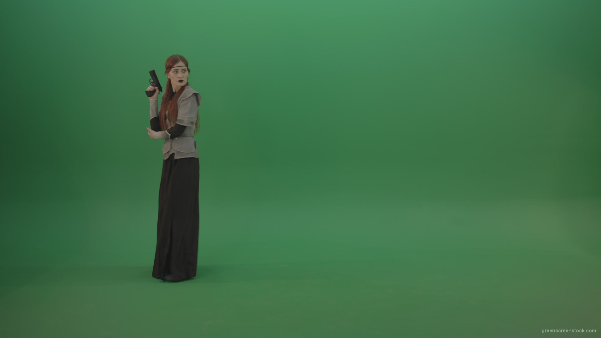 Girl-dressed-in-an-ancient-costume-holds-a-gun-in-her-hands-walks-and-shoots_002 Green Screen Stock