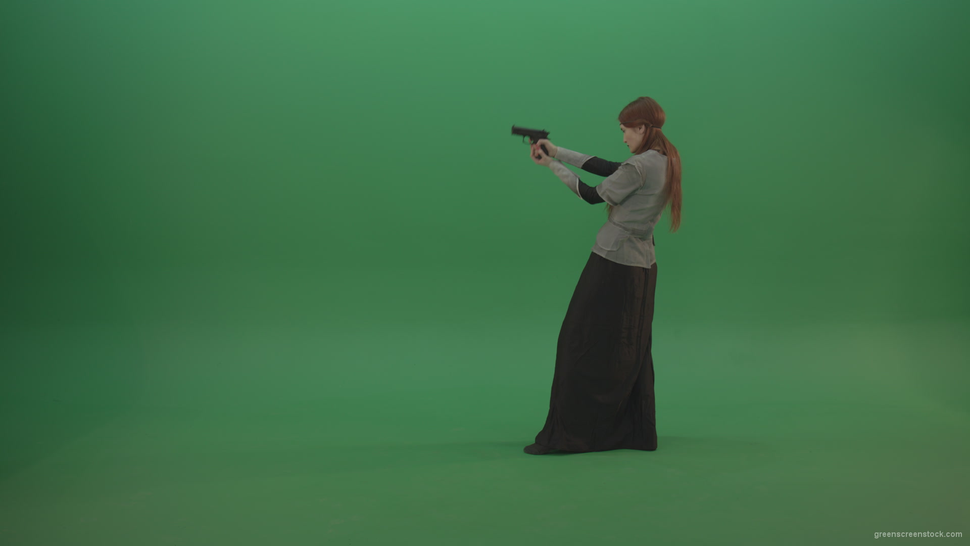 Girl-dressed-in-an-ancient-costume-holds-a-gun-in-her-hands-walks-and-shoots_006 Green Screen Stock