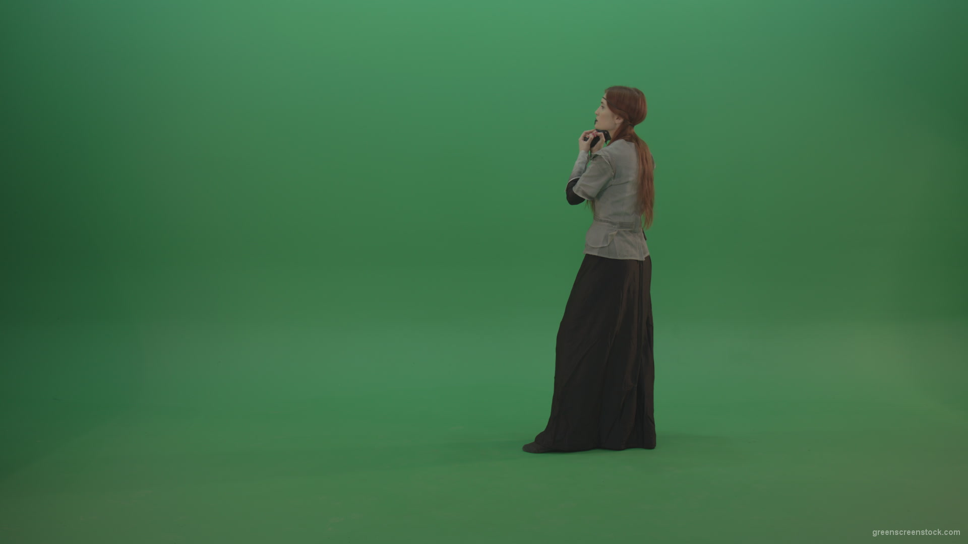Girl-dressed-in-an-ancient-costume-holds-a-gun-in-her-hands-walks-and-shoots_007 Green Screen Stock
