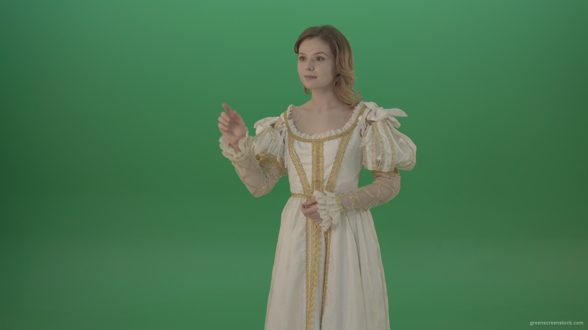 Girl-flips-a-virtual-screen-dressed-in-a-medieval-costume-isolated-on-green-screen_002 Green Screen Stock