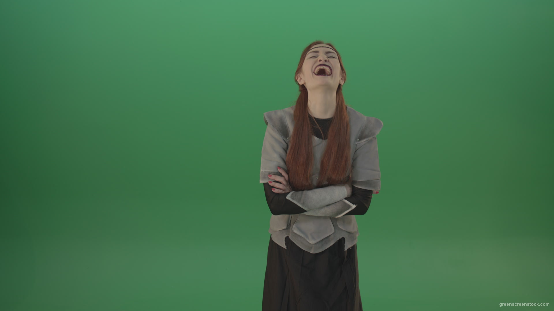Girl-in-a-medieval-wig-costume-laughs-on-a-green-background-1_002 Green Screen Stock