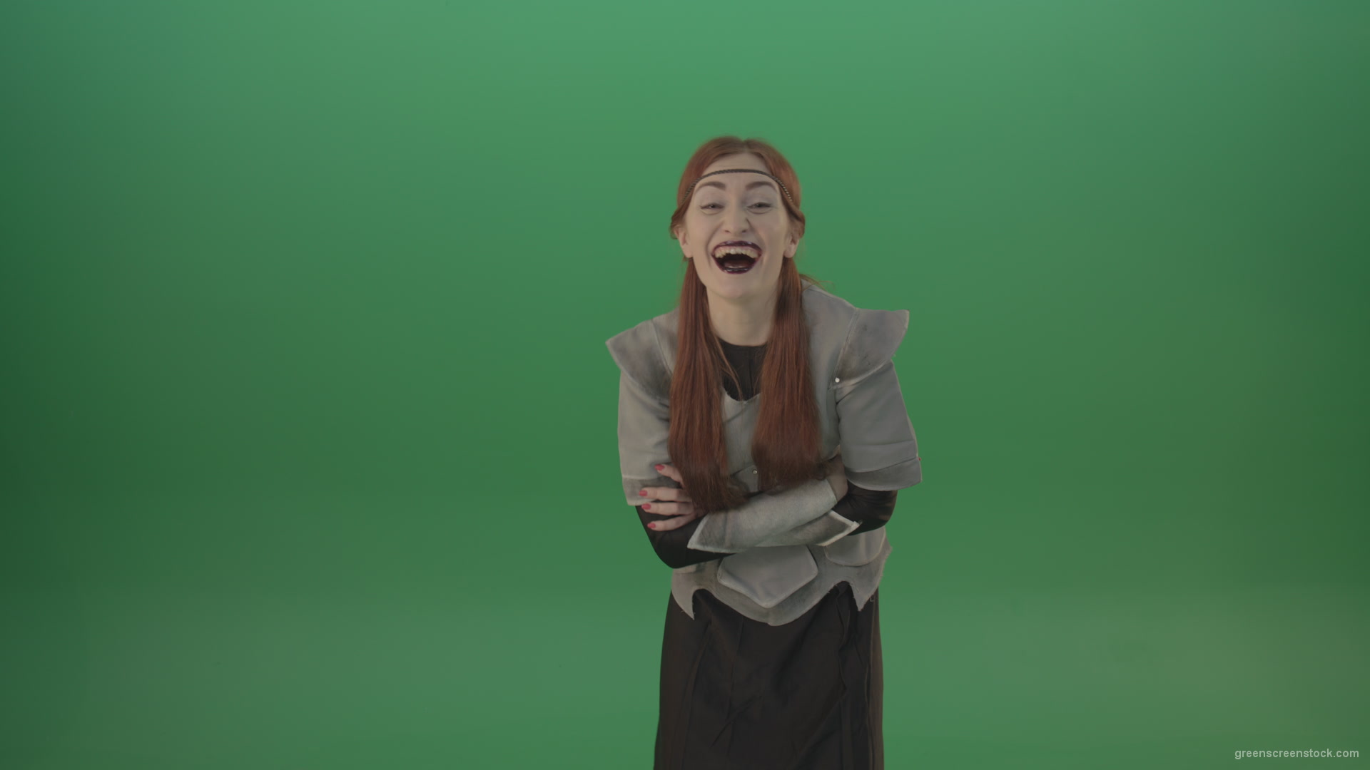Girl-in-a-medieval-wig-costume-laughs-on-a-green-background-1_005 Green Screen Stock